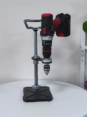 The same U1 station holding a cordless drill, ready to drill vertically