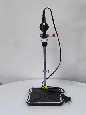 P1 press seen from the front, showing the tip above the base plate