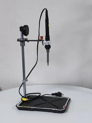 P1 press in side view with the return spring visible